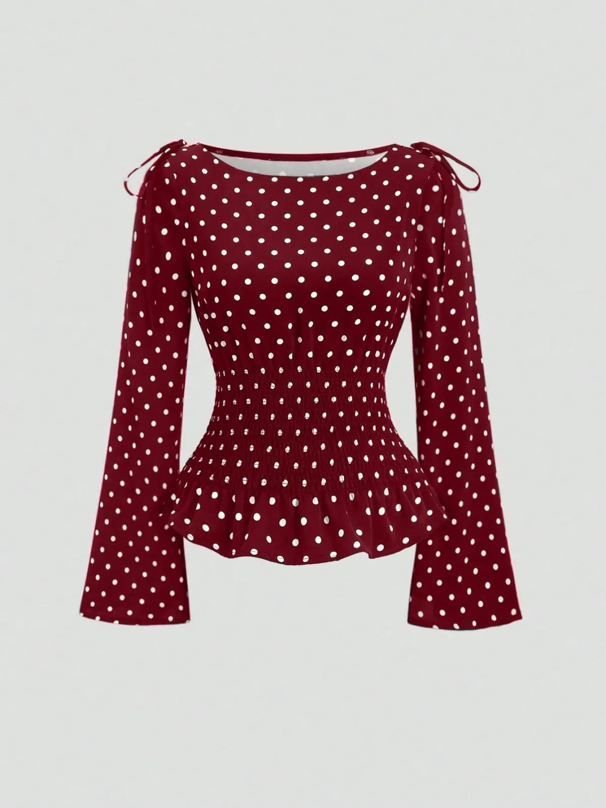 blouse à pois avec taille smockée et nœuds aux épaules