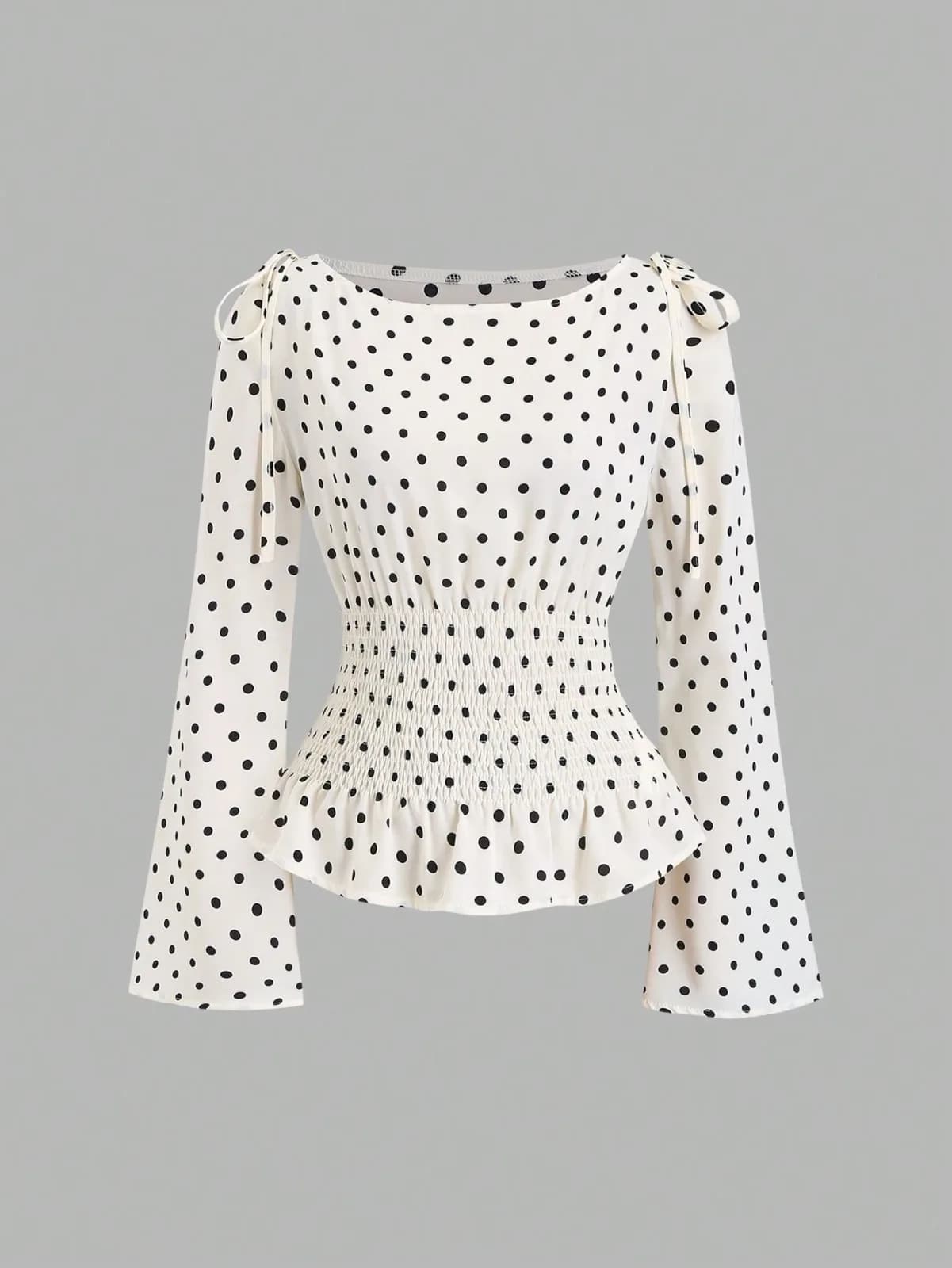blouse à pois avec taille smockée et nœuds aux épaules