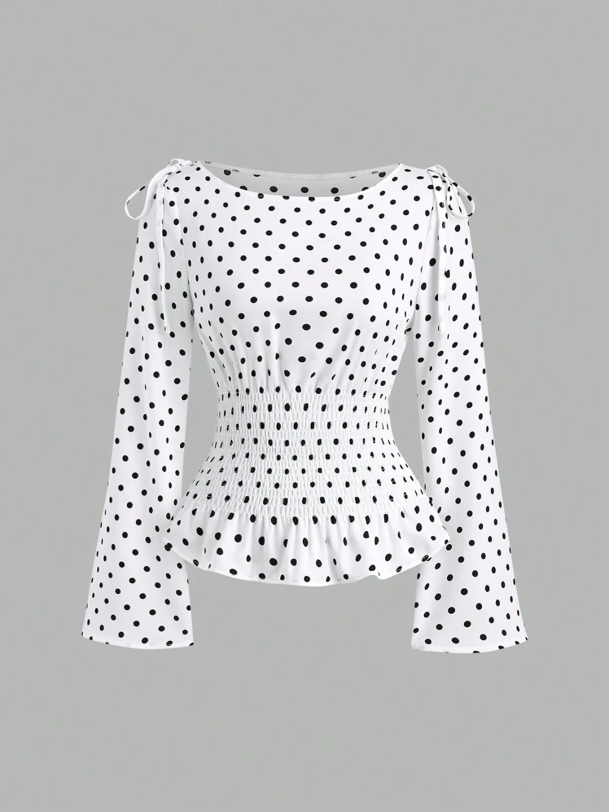 blouse à pois avec taille smockée et nœuds aux épaules