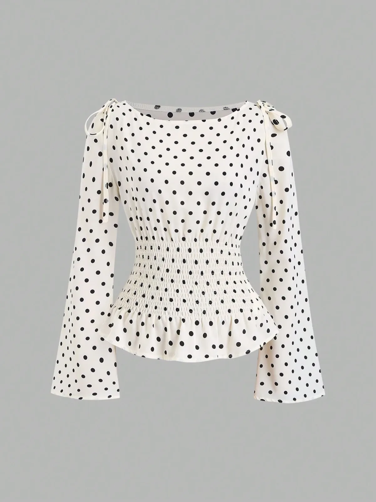 blouse à pois avec taille smockée et nœuds aux épaules